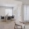 a room with a table chairs and a rug